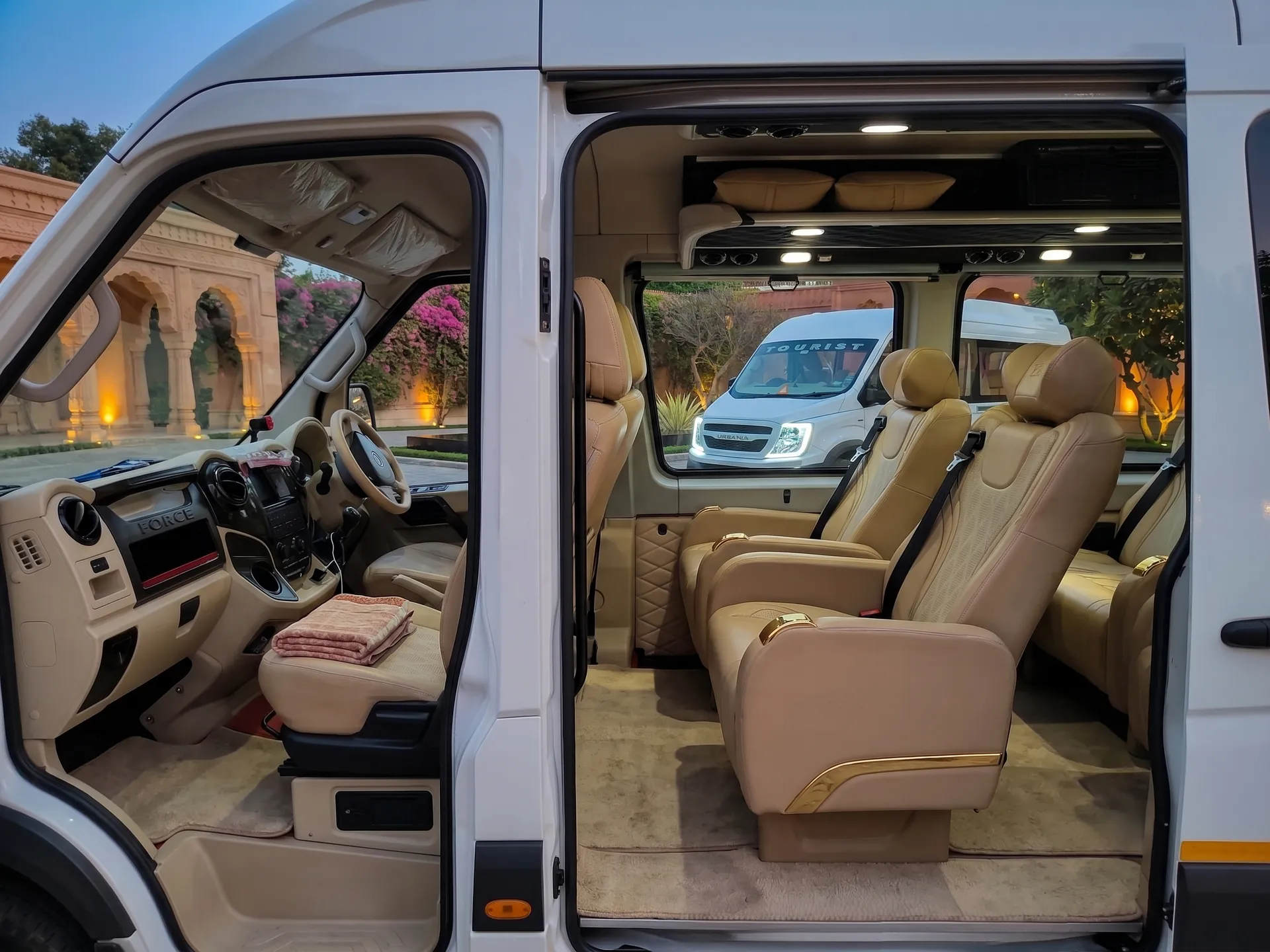 Luxury captains seat configuration inside the Maharaja Urbania with orange and dark leather accents